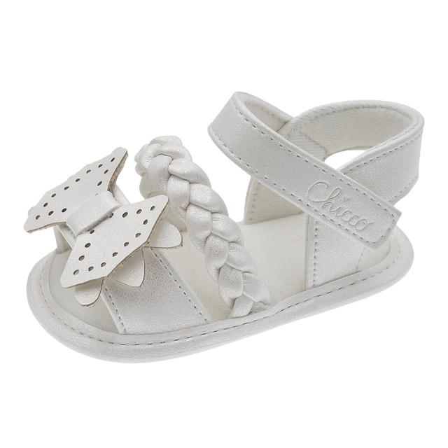 Sandalo da bambina Chicco Ortina beige con punta aperta, fascia intrecciata e fiocco, chiusura a strappo regolabile per un comfort ottimale. | Chicco