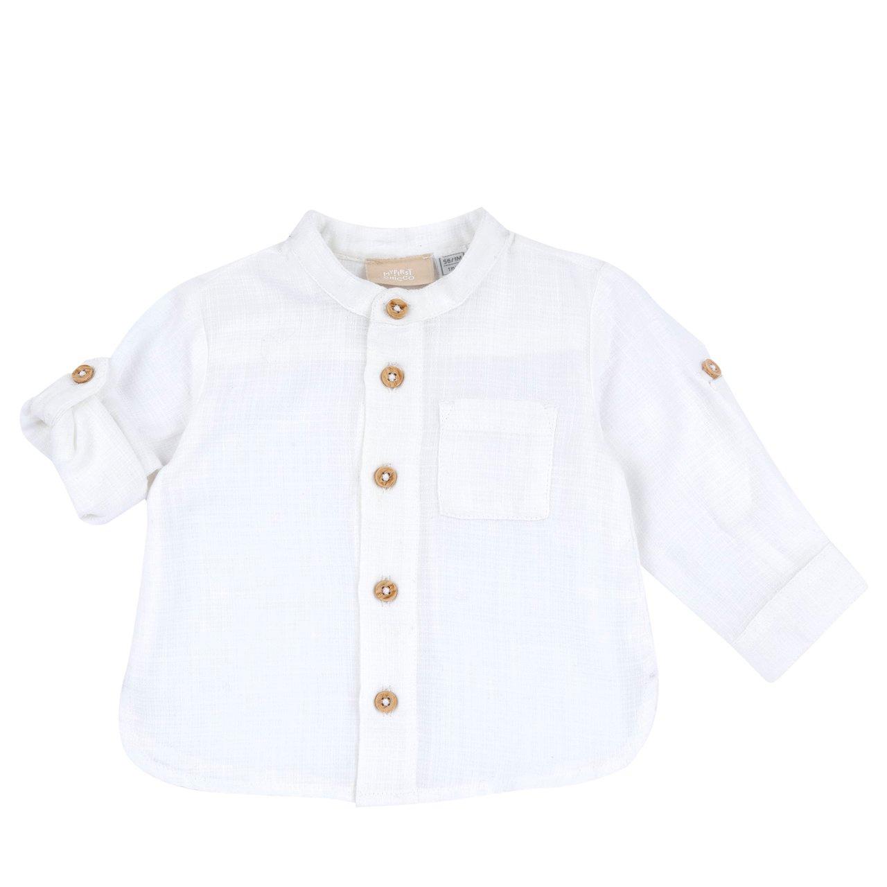 Camicia bianca a manica lunga per bambino Chicco con collo alla coreana, bottoni effetto legno e taschino frontale, realizzata in cotone effetto lino. | Chicco