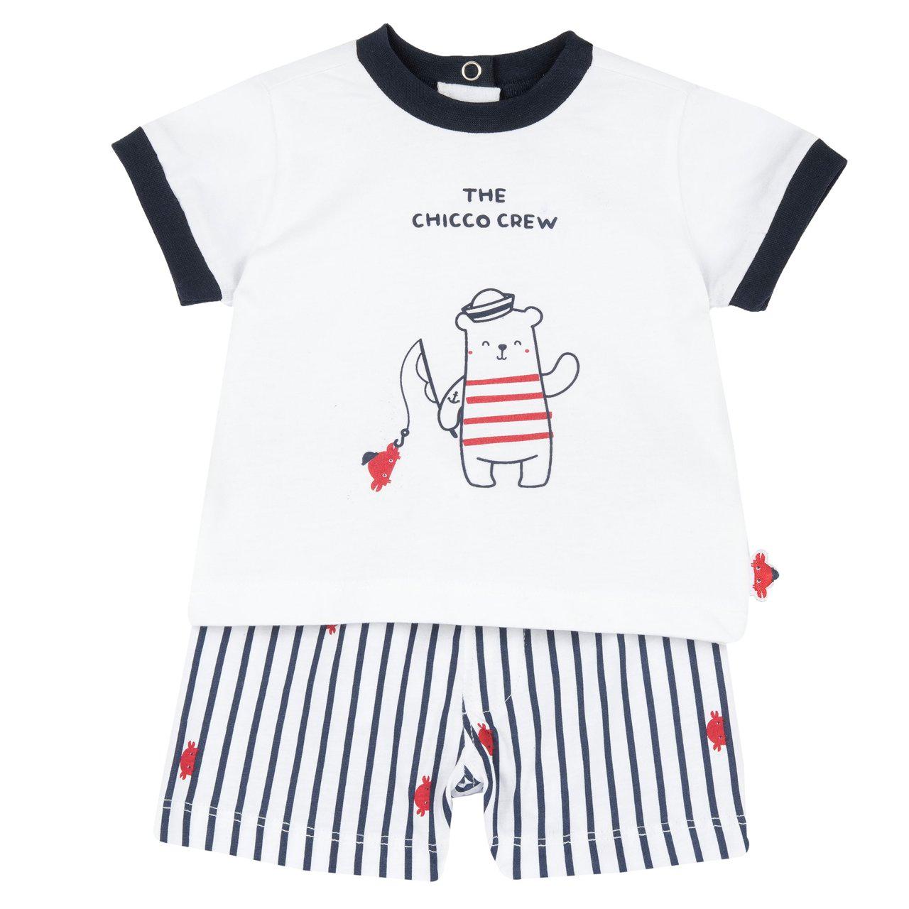 Completo mare Chicco per bambino in jersey di cotone, maglietta bianca con stampa rilievo e pantaloncini fantasia con vita elasticizzata e coulisse. | Chicco