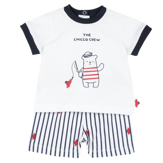 Completo mare Chicco per bambino in jersey di cotone, maglietta bianca con stampa rilievo e pantaloncini fantasia con vita elasticizzata e coulisse. | Chicco