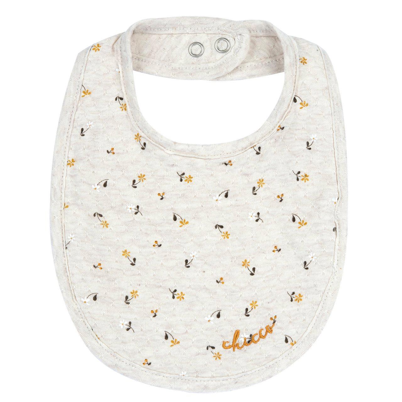 Bavaglino Chicco beige in jersey jacquard per bambina, con fantasia di fiorellini e grafica ricamata, ideale per primavera/estate. | Chicco