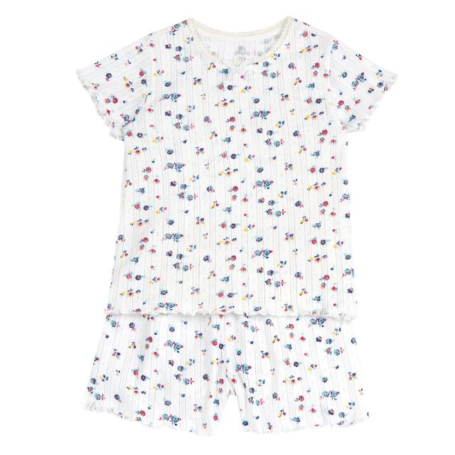 Pigiama corto Chicco in cotone operato beige per bambina, con stampa fantasia floreale, pizzo e fiocchetto sul collo, vita elasticizzata. | Chicco