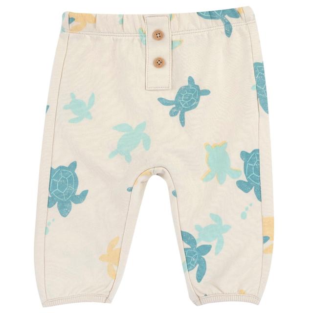 Pantaloni lunghi bianchi Chicco per bambino in morbida felpa di cotone sostenibile con stampa grafica e finta apertura bottoni effetto legno. | Chicco