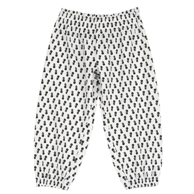 Pantaloni lunghi balloon fit Chicco per bambina in jersey slub elasticizzato bianco con stampa fantasia di fiorellini monocolore, vita e fondo gamba elasticizzati. | Chicco