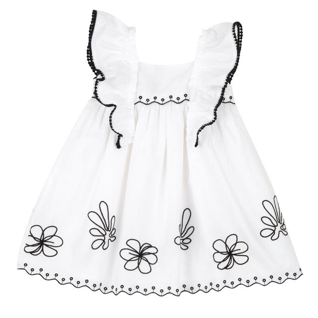Vestito bianco Chicco a manica corta in popeline di cotone per bambina, con ricamo a smerlo a contrasto sul fondo e nastro con pom-pon decorativi sulle maniche. | Chicco