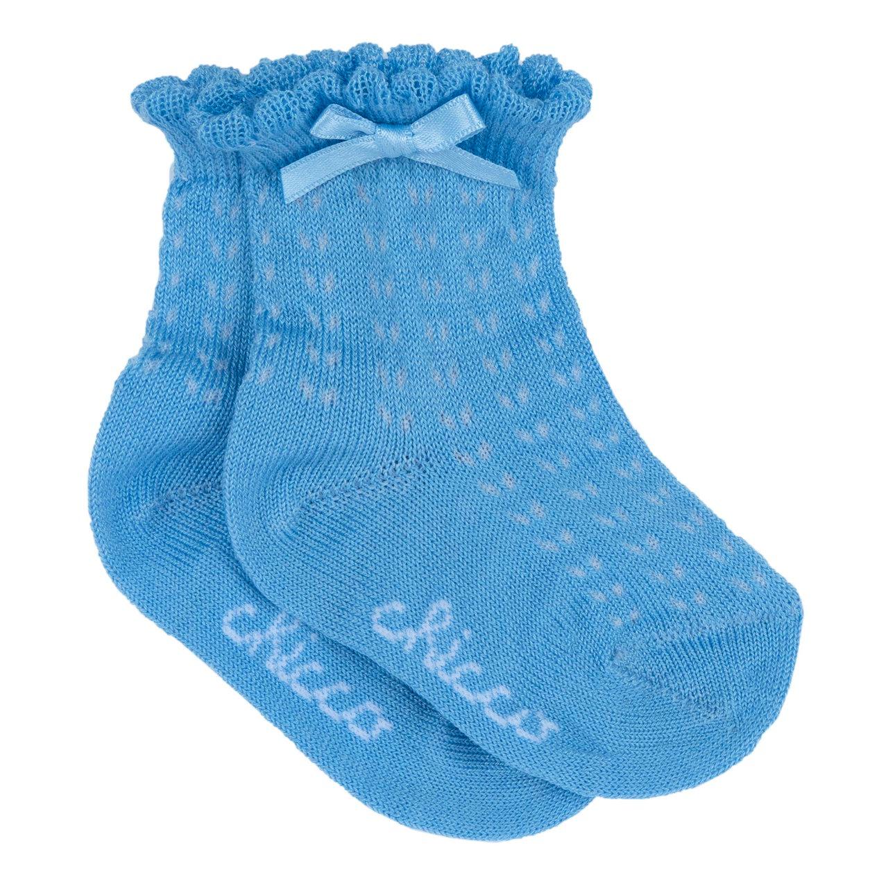 Calzini traforati azzurri Chicco per bambina in cotone mercerizzato sostenibile, con disegno jacquard, smerli e fiocchetto di raso. | Chicco