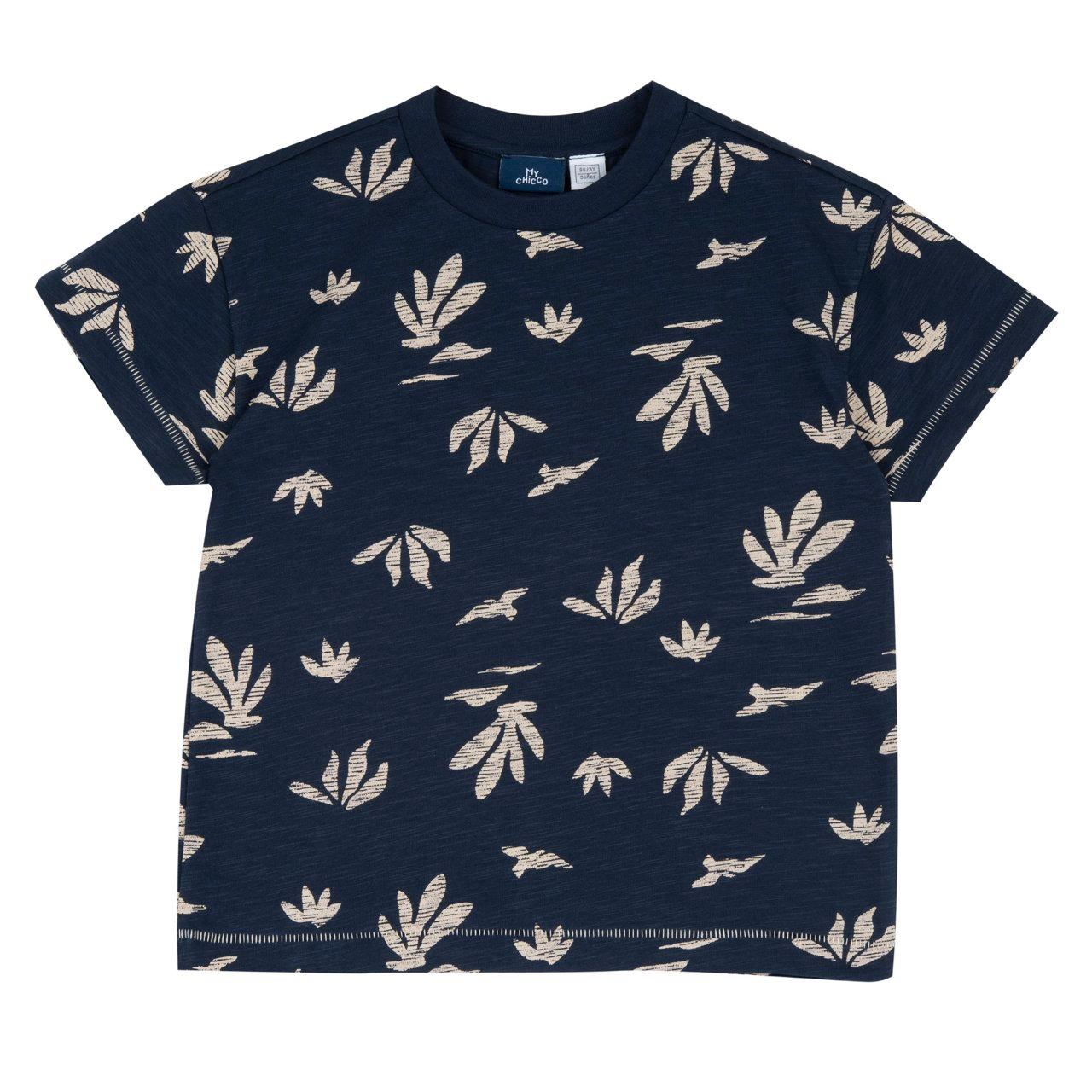 Maglietta a manica corta in cotone biologico Chicco per bambino con fantasia monocromatica di palme su sfondo bianco e maniche risvoltate. | Chicco