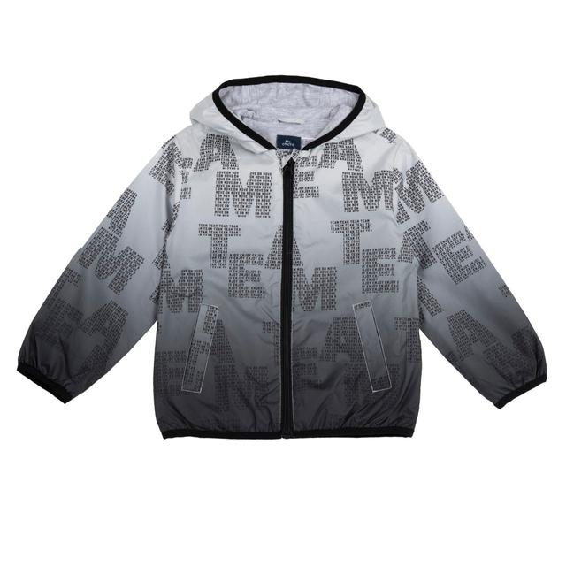 Giubbino antivento per bambino Chicco con vivace stampa dinosauro su sfondo verde, realizzato in tessuto tecnico riciclato impermeabile. | Chicco