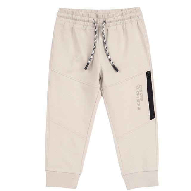 Pantaloni jogger lunghi rossi in cotone sostenibile Chicco per bambino, con vita elasticizzata, cordino, stampa a rilievo e tasca con zip sulla gamba. | Chicco