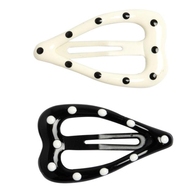 Set due mollette per capelli Chicco a forma di cuore con pois bianchi su sfondo nero, ideali per bambine. | Chicco