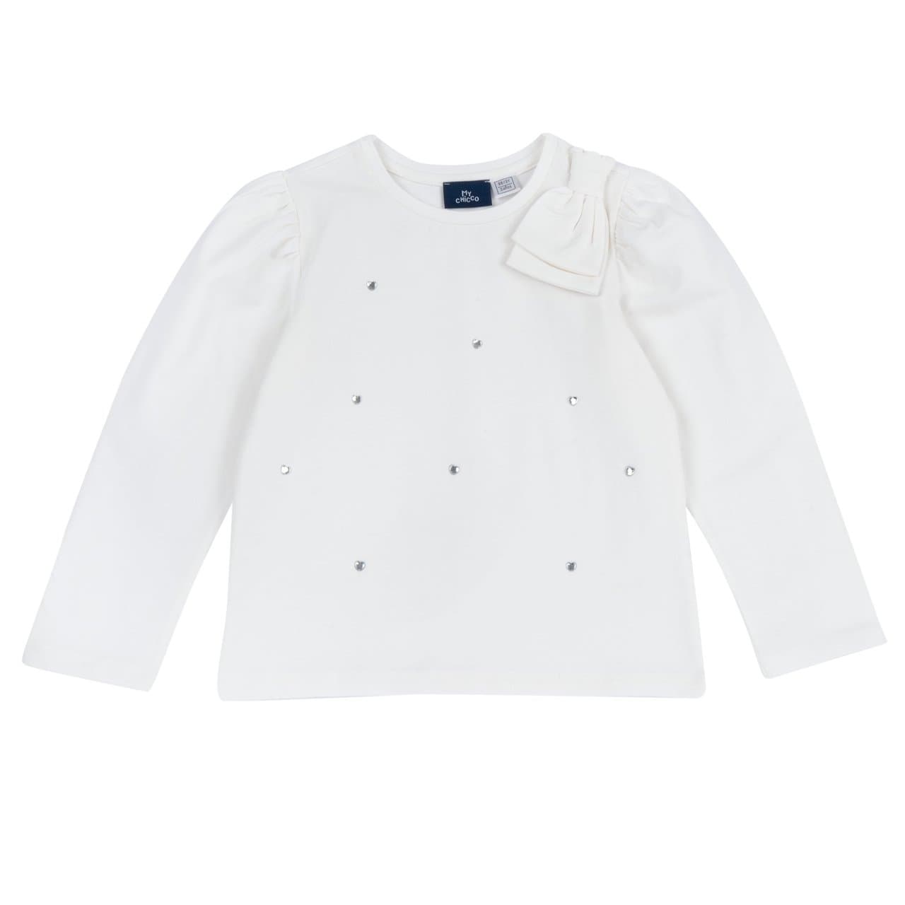 Maglietta Manica Lunga | Chicco Maglietta a manica lunga Chicco bianca in jersey elasticizzato di cotone per bambina, con doppio fiocco sulla spalla e dettaglio a cuore sul davanti. | Chicco