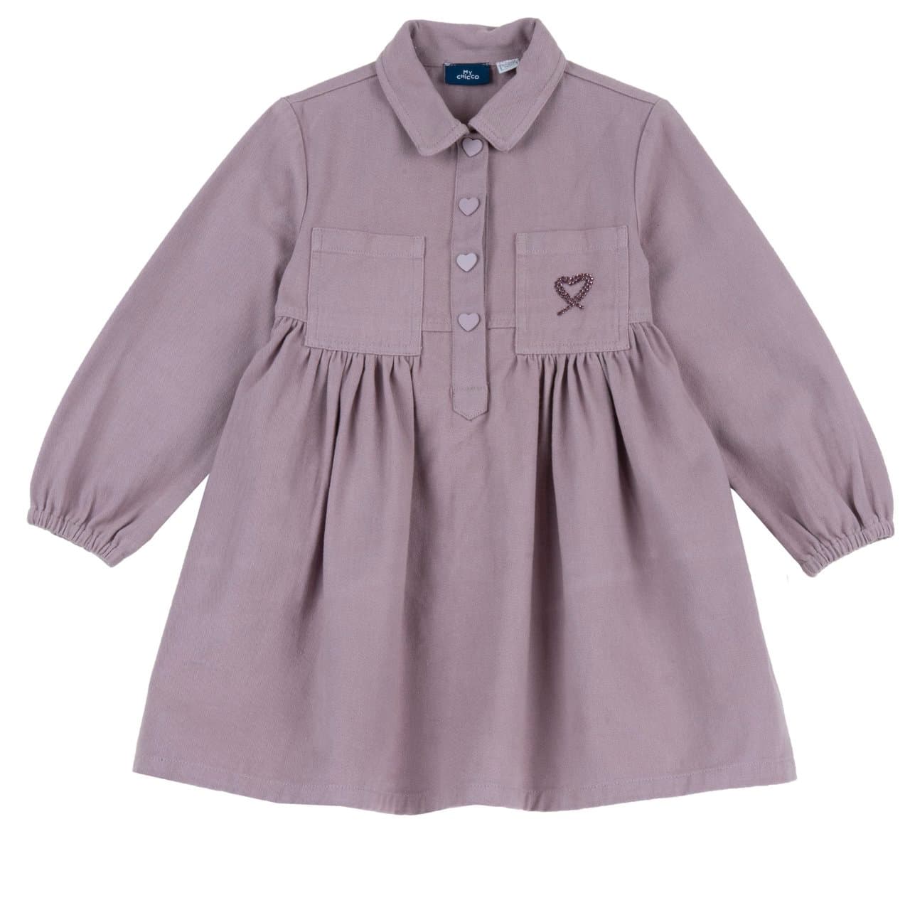 Vestito Manica Lunga | Chicco Vestito Chicco a manica lunga viola in twill 100% cotone per bambina, con arricciatura in vita, tasche applicate e cuore in strass sulla sinistra. | Chicco