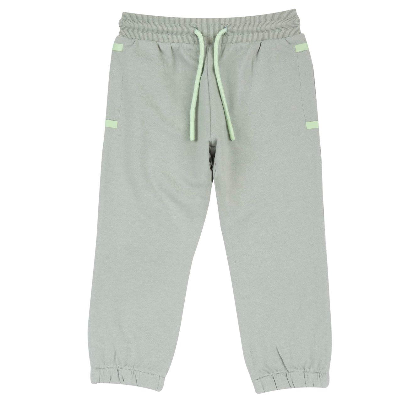 Pantaloni Lunghi | Chicco Pantaloni jogger Chicco verdi in felpa non garzata per bambino, con vita elasticizzata, cordino, tasche con stampa decorativa e elastico interno sul fondo gamba, ideali per autunno/inverno. | Chicco