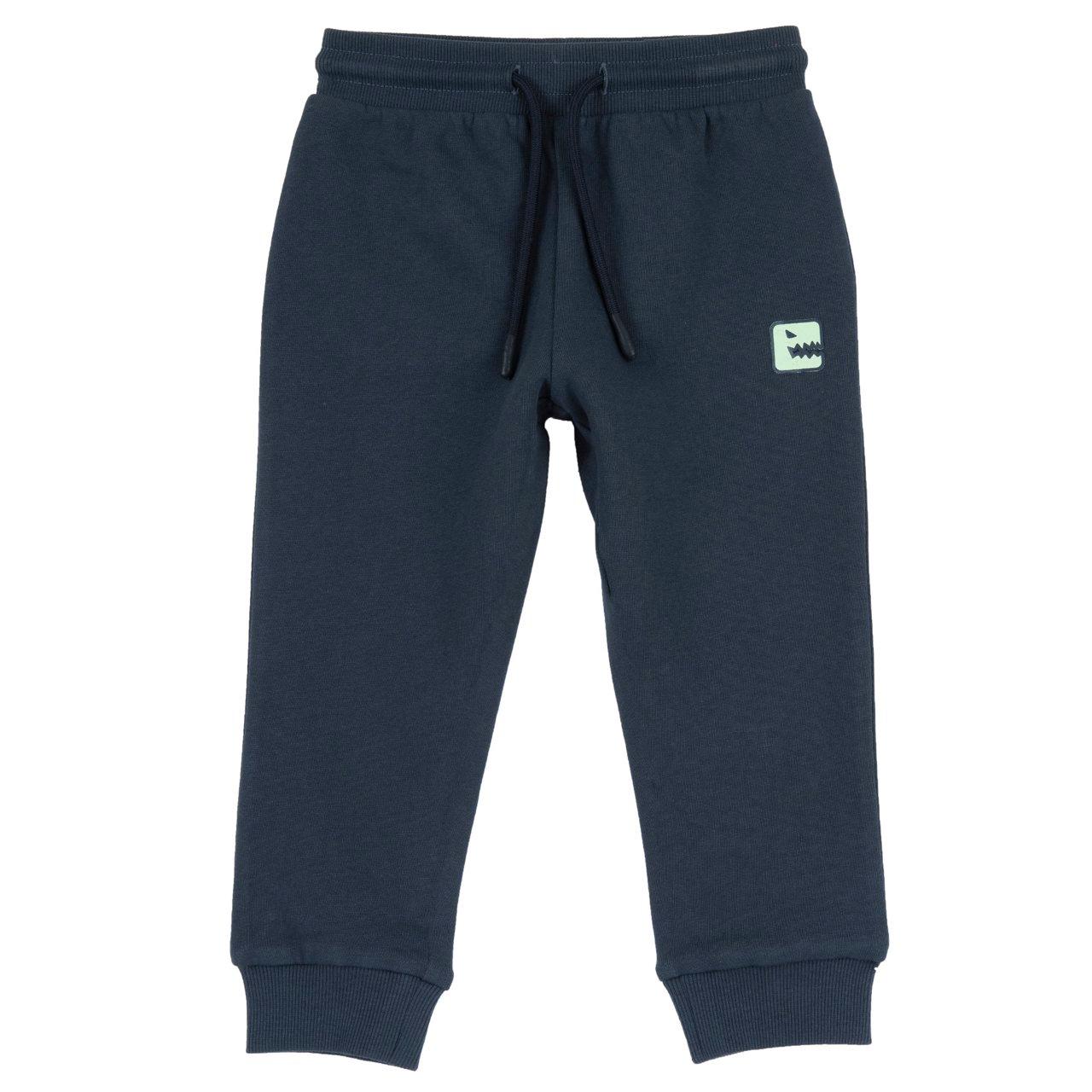 Pantaloni Lunghi | Chicco Pantaloni jogger Chicco verdi in felpa garzata per bambino, con stampa dinosauro gommata, vita elasticizzata e cordino, ideali per autunno/inverno. | Chicco