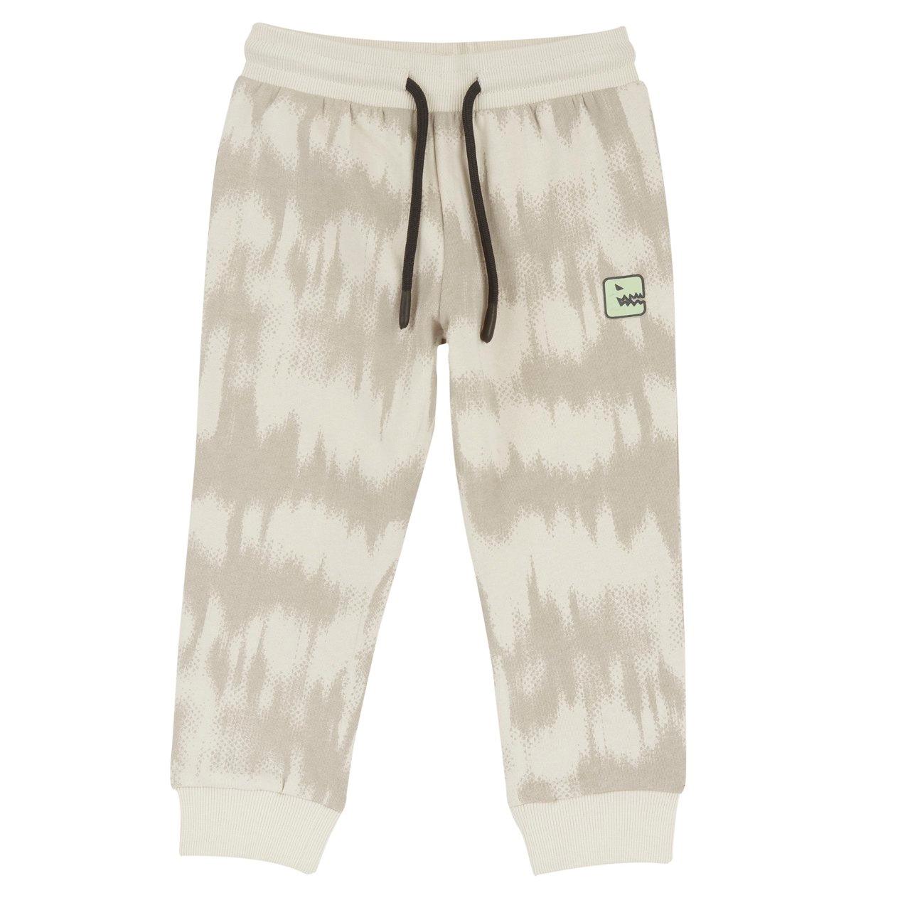 Pantaloni Lunghi Fantasia | Chicco Pantaloni lunghi jogger Chicco bianchi in felpa garzata con fantasia tie-dye e stampa dinosauro gommata, vita elasticizzata e polsini a costine. | Chicco